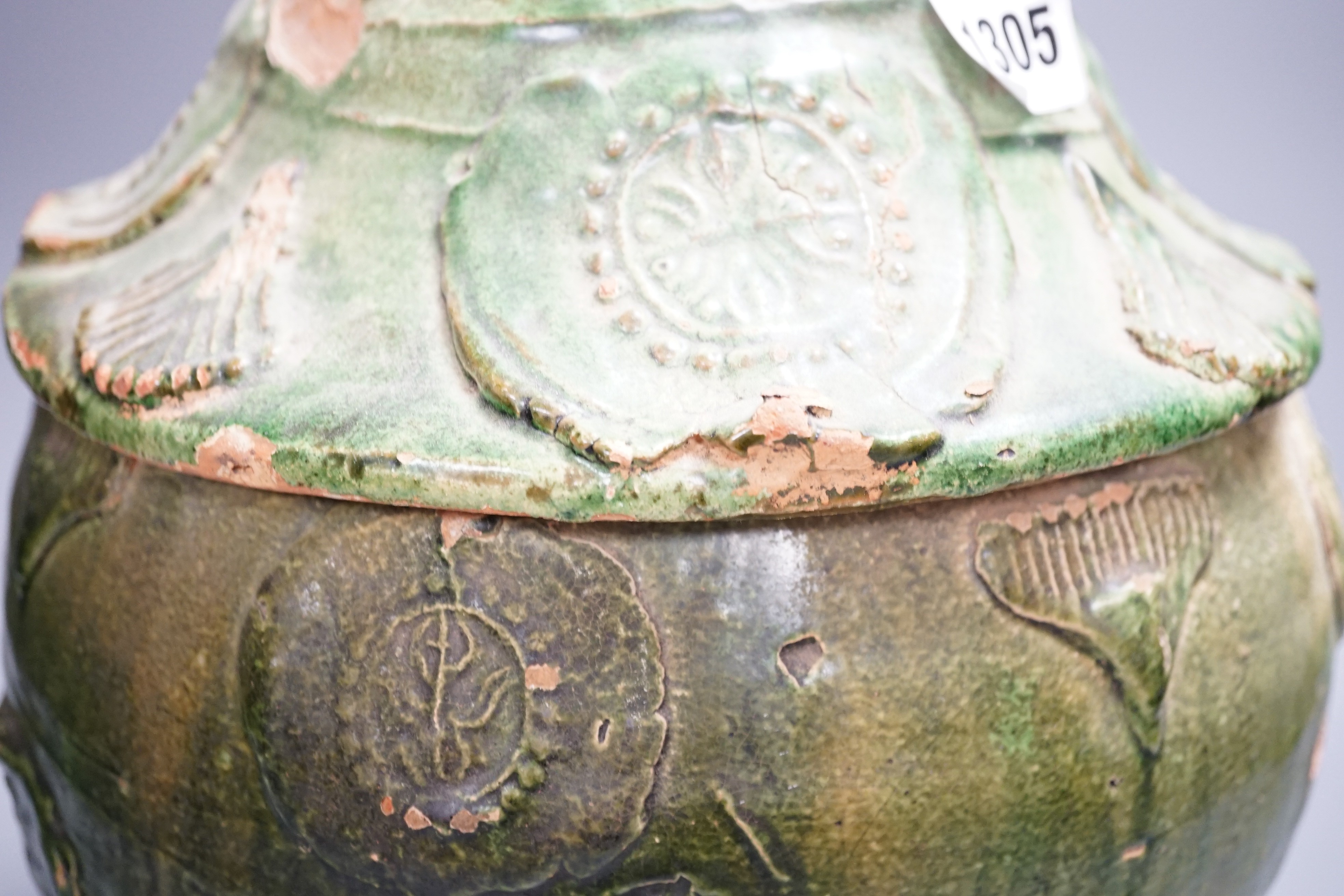 A large Chinese green glazed jar and cover, Liao dynasty, 35cm high